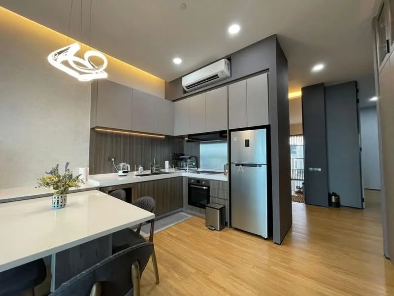 Kitchen features: grey cabinetry, white countertop, stainless-steel fridge, built-in oven, 4-burner gas hob, stainless-steel sink, chrome pull-down faucet, pendant light fixture, recessed downlights, wooden flooring, open layout with dining area; style: modern.