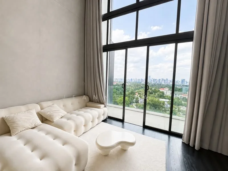 Living features: cream tufted sofa, white coffee table, floor-to-ceiling windows, black hardwood flooring, sheer curtains, city skyline view, light grey accent wall, area rug; style: modern; view: city.