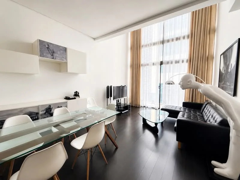 Living features: black leather sofa, glass coffee table, white dining table, 6 white dining chairs, TV console, wall-mounted TV, large windows with sheer curtains, dark wood flooring, white painted walls, decorative artwork on walls, floor lamp, shelf unit with decorative items; style: modern; view: city.