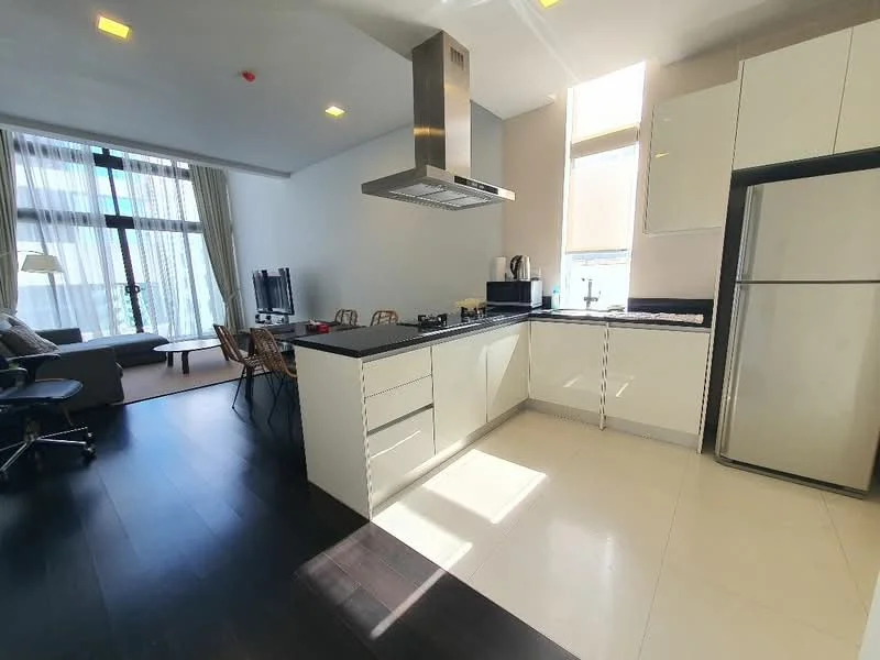 Kitchen features: white cabinetry, black countertop, stainless-steel range hood, built-in oven, stainless-steel fridge, single-bowl stainless-steel sink, chrome pull-down faucet, ceramic tile flooring, recessed downlights, floor-to-ceiling windows, open-plan layout, bar stools, kitchen island; style: modern; view: city. Living features: 3-seater fabric sofa, coffee table, TV console, wall-mounted TV, area rug, floor-to-ceiling windows; style: modern; view: city.