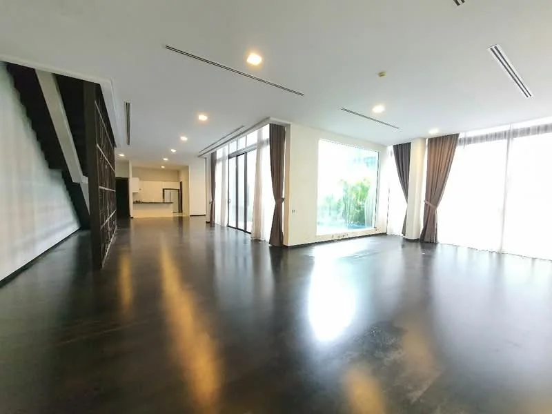 Room features: dark hardwood flooring, white painted walls, floor-to-ceiling windows, sheer curtains, recessed downlights, open layout, staircase visible in background, high ceiling; style: modern; view: garden.