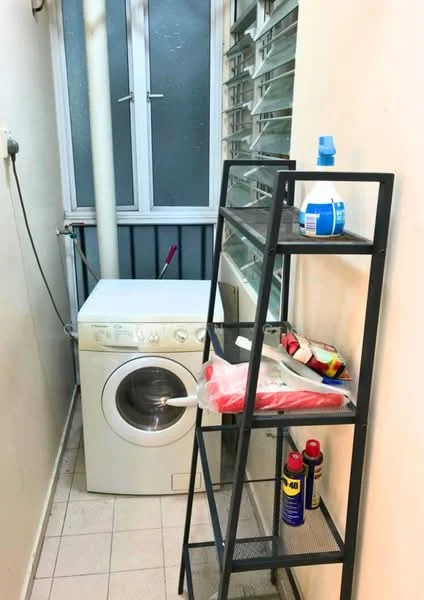 Laundry features: front-load washing machine in white, metal shelving unit, cleaning supplies on shelves, window with horizontal slats, tile flooring, light-colored walls, plumbing pipe visible, mop and broom leaning against wall.