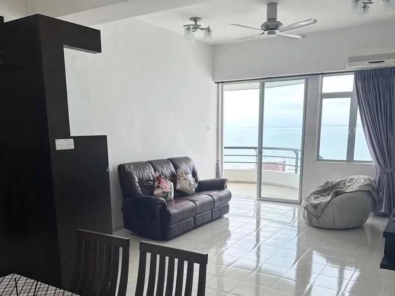 Living features: 3-seater leather sofa in brown, floor-to-ceiling windows, sea view, white painted walls, glossy tile flooring, ceiling fan, curtains in purple, coffee table, bean bag chair, dining table with chairs; style: modern; view: sea.