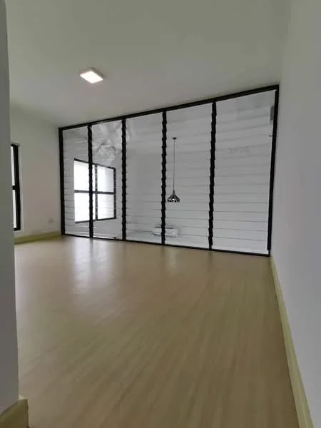 Room features: light wood flooring, white painted walls, black framed glass partition, ceiling light fixture, large windows with black frames, minimalist design, neutral color palette; style: modern.
