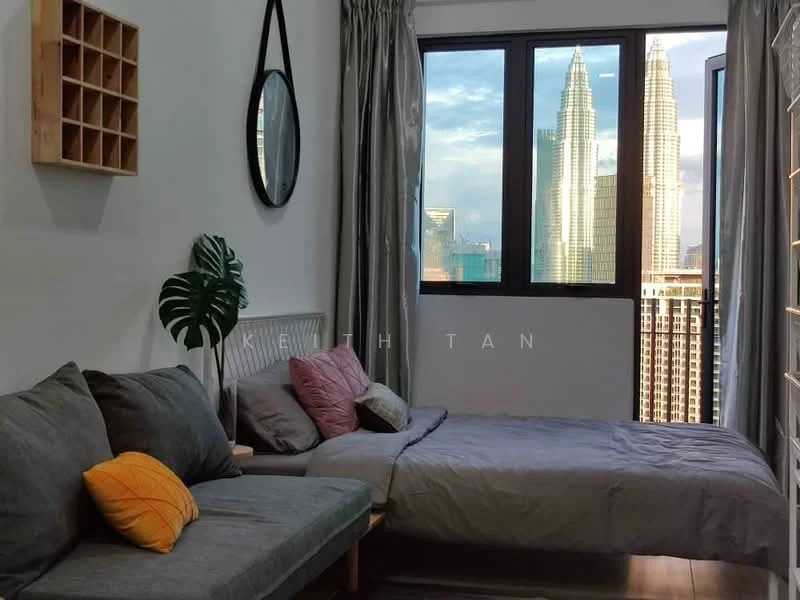Bedroom features: queen-size bed with grey bedding, upholstered headboard, sofa in grey fabric, decorative cushions in pink and yellow, floor-to-ceiling windows, curtains in grey, wooden flooring, wall-mounted mirror, plant in ceramic pot, wooden shelving unit; style: modern; view: city.