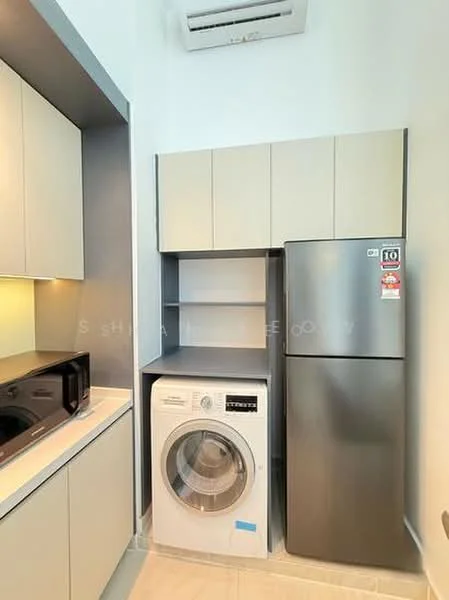 Laundry features: built-in cabinetry in light grey, white front-load washing machine, stainless-steel fridge, microwave oven, countertop, wall-mounted split AC, tile flooring, recessed lighting; style: modern.