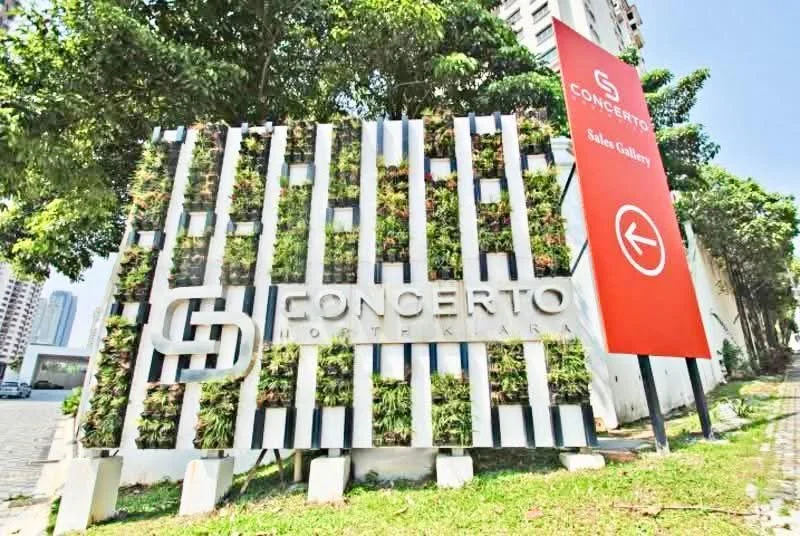 Exterior features: signage with the name 'Concerto', landscaped greenery around the sign, red directional sign, paved walkway, urban setting with nearby buildings; style: modern.