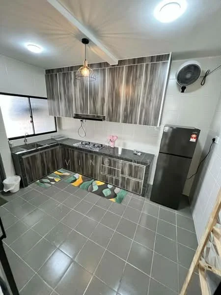 Kitchen features: grey and brown wood grain cabinetry, black countertop, stainless-steel sink, chrome pull-down faucet, built-in stove with hood, refrigerator, grey tiled flooring, wall-mounted exhaust fan, window with black frame, decorative kitchen mat with leaf pattern, recessed ceiling lights; style: modern.
