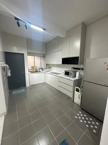Kitchen features: grey cabinetry, white countertop, stainless-steel fridge, built-in microwave, freestanding range oven, single-bowl stainless-steel sink, chrome pull-down faucet, tile backsplash, grey tile flooring, recessed downlights, window with sheer curtains, kitchen island, decorative rug with stars; style: modern.