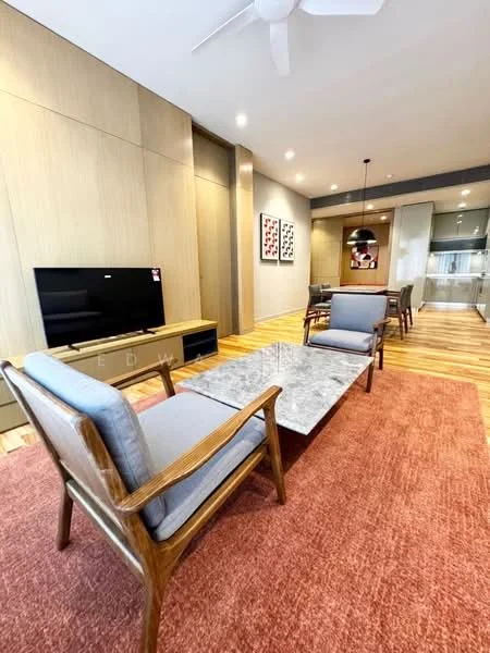 Living features: wooden flooring, grey fabric armchairs, marble coffee table, wall-mounted TV, light wood feature wall, recessed lighting, ceiling fan, area rug with geometric pattern, dining area visible in background, decorative wall art; style: modern.