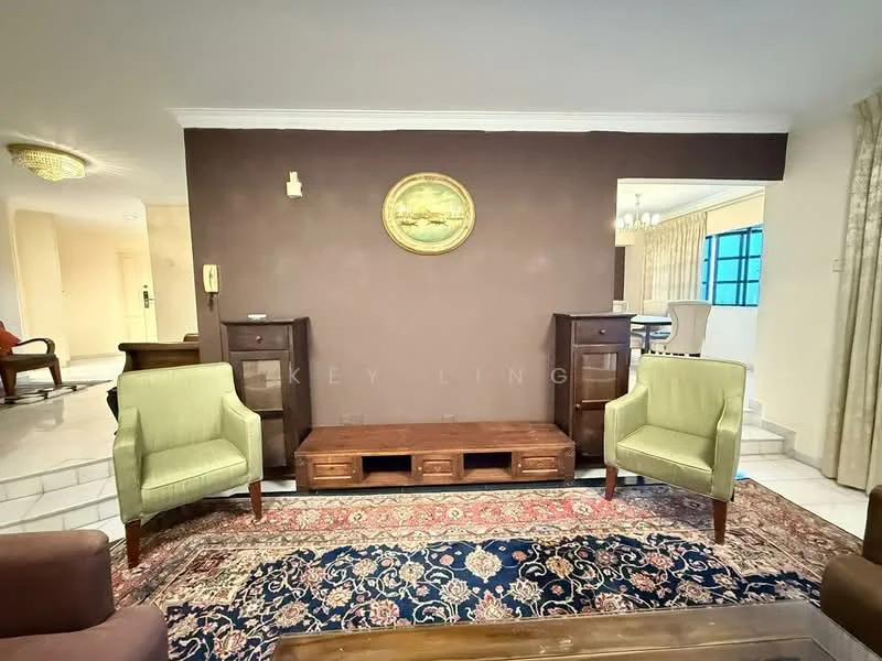 Living features: brown accent wall, cream ceiling, chandelier, wooden coffee table, green upholstered armchairs, dark wood side tables, decorative wall art, traditional area rug; style: traditional.