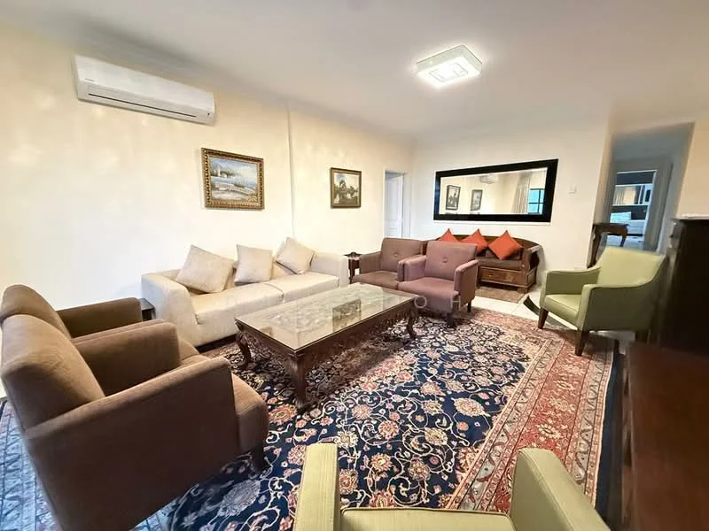 Living features: 3-seater fabric sofa in beige, 2-seater fabric sofa in brown, 2 armchairs in green, coffee table with glass top, decorative area rug with intricate pattern, wall-mounted split AC, framed artwork on walls, large mirror on wall, wooden sideboard, cushions in red on sofa; style: contemporary.