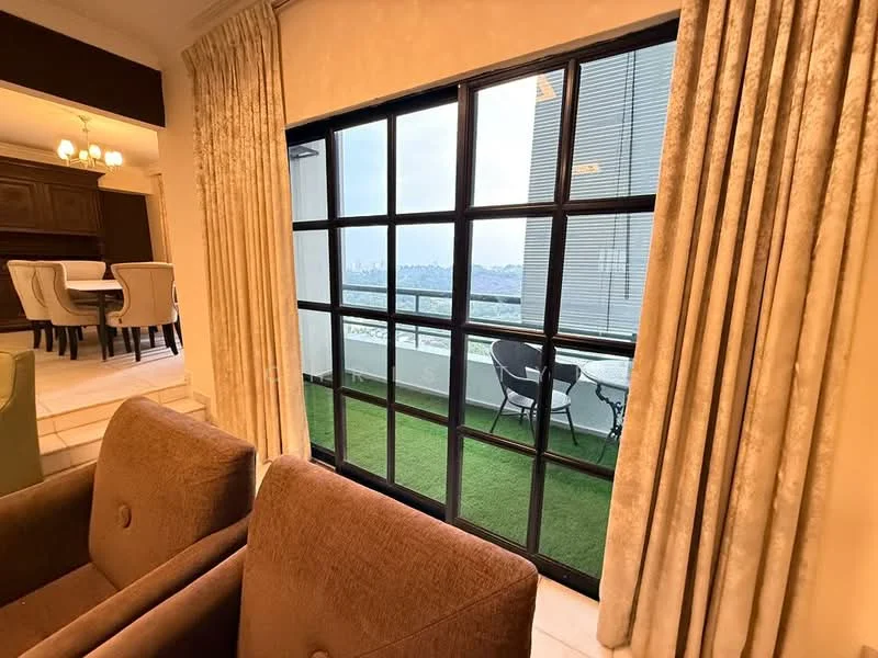 Living features: floor-to-ceiling windows, black framed window, sheer curtains, green grass balcony view, two brown fabric armchairs, decorative wall paneling, dining area visible in background, light fixture with multiple bulbs; style: modern; view: city.