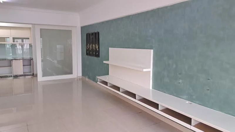 Living features: light green textured wall, white feature wall unit, glossy beige tile flooring, recessed lighting, large glass sliding door, open layout to kitchen, built-in shelving, neutral color palette; style: modern.