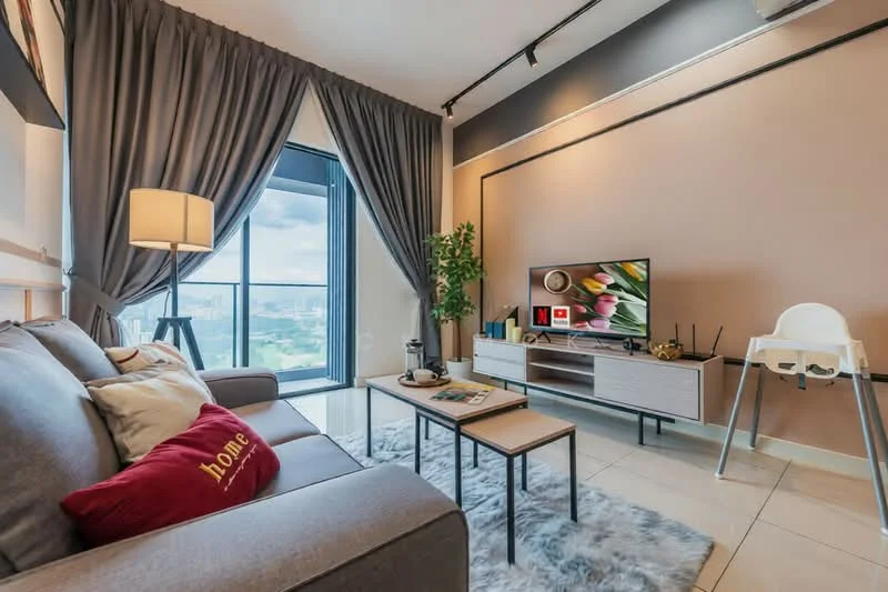 Living features: grey fabric sofa, red decorative pillow with text, coffee table, TV console, wall-mounted TV, area rug with fluffy texture, floor-to-ceiling windows, curtains in grey fabric, indoor plant, light floor tiles, wall with beige paint, shelf with decorative items; style: modern; view: city.