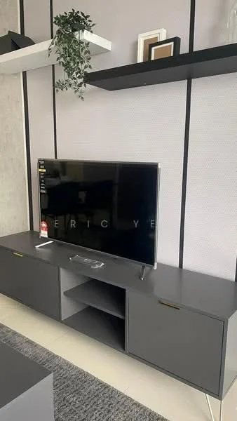 Living features: black TV console with storage cabinets, wall-mounted flat-screen TV, decorative shelf above TV, grey area rug, light-colored wall with texture, greenery in a pot, minimalist decor items on shelf; style: modern.