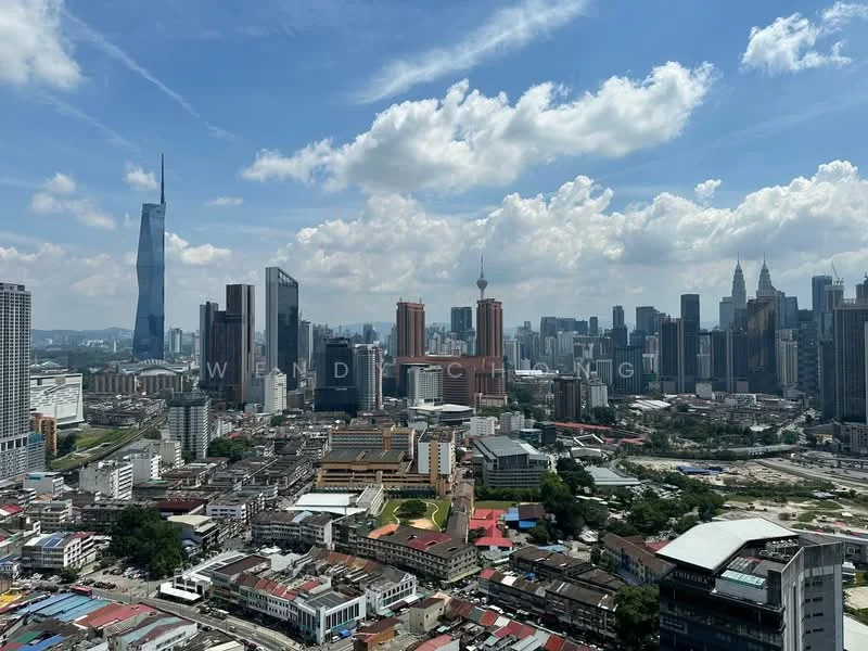 Exterior type: high-rise condominium; features: city skyline view, surrounded by urban landscape, various building heights, prominent skyscrapers, mixed-use development, green spaces visible, road infrastructure, commercial buildings, residential buildings; style: modern.