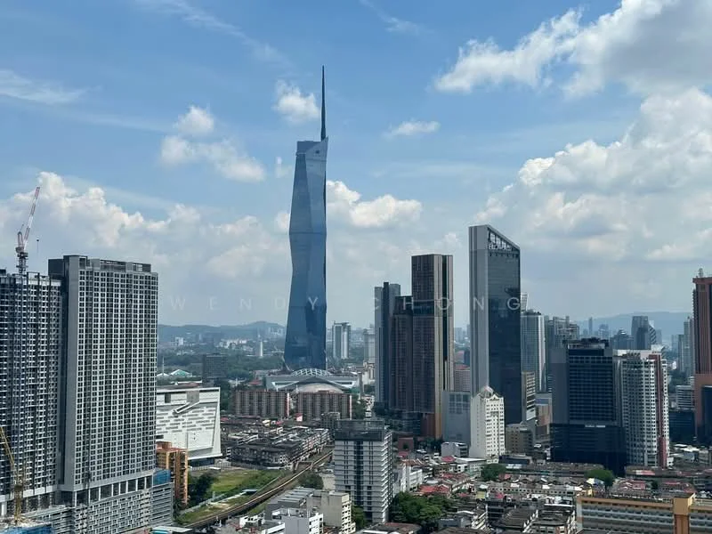 Exterior type: high-rise condominium; features: city skyline view, modern architectural design, glass curtain wall, surrounded by urban landscape, prominent landmark in background, variety of building heights, mixed-use development, clear blue sky; style: modern.