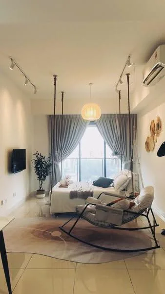 Living features: white painted walls, glossy tile flooring, 5-blade ceiling fan, recessed downlights, hanging pendant light, floor-to-ceiling windows, sheer curtains, decorative wall art, rocking chair, sofa with cushions, area rug with circular pattern, indoor plant in pot, wall-mounted TV; style: modern; view: city.