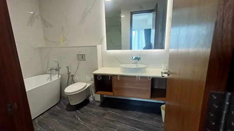 Bathroom features: freestanding bathtub, one-piece toilet, single-sink vanity with wood cabinet, round vessel sink, chrome basin mixer, large mirror with backlighting, marble wall cladding, dark stone flooring, built-in shelving, recessed lighting; style: modern.