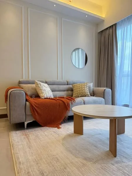Living features: grey fabric 3-seater sofa, orange knitted throw blanket, round mirror on wall, light beige area rug, wooden coffee table, floor-to-ceiling windows with sheer curtains, white painted walls with paneling, recessed ceiling lights; style: modern.