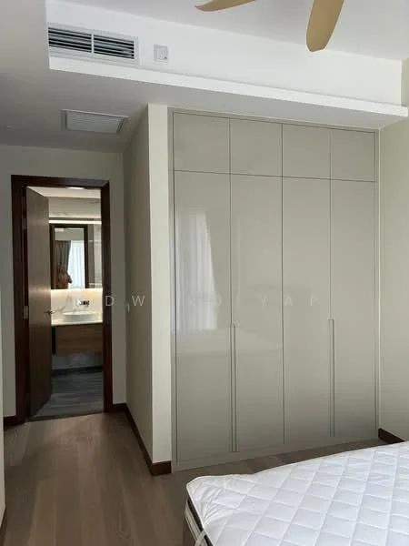 Bedroom features: built-in wardrobe with glossy finish, wooden flooring, ceiling fan, neutral wall colour, doorway leading to bathroom, window with natural light, unmade bed with mattress, recessed ceiling lights; style: modern.