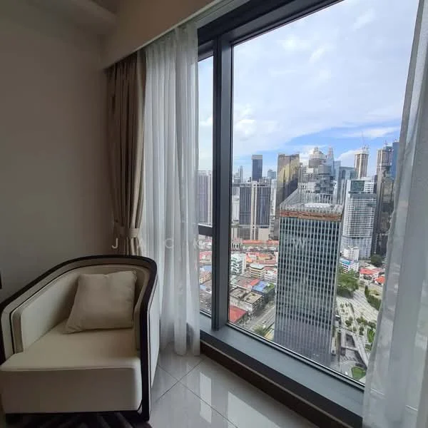 Room features: floor-to-ceiling windows, city skyline view, white walls, grey tile flooring, curtains, armchair in cream color, decorative pillow; style: modern; view: city.