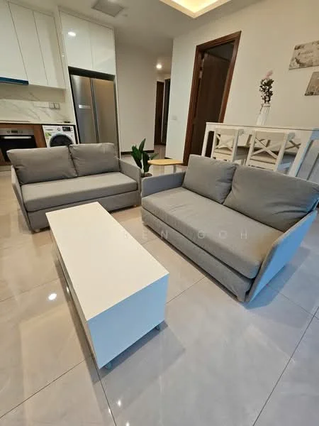 Living features: 2-seater fabric sofa in grey, 3-seater fabric sofa in grey, white coffee table, marble tile flooring, recessed ceiling lights, wall-mounted artwork, plant in ceramic pot, open layout to kitchen, built-in cabinetry, kitchen appliances visible in background; style: modern.