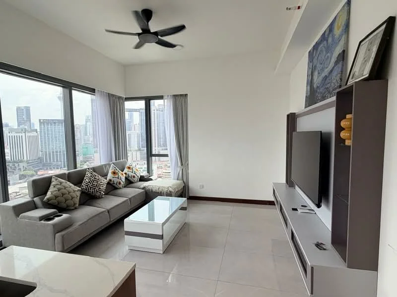 Living features: L-shape sectional sofa in grey, decorative throw pillows with patterns, coffee table with white top and grey base, wall-mounted TV, TV console with storage, floor-to-ceiling windows, city skyline view, ceiling fan with light, light-colored walls, tile flooring, curtains in light grey; style: modern; view: city.