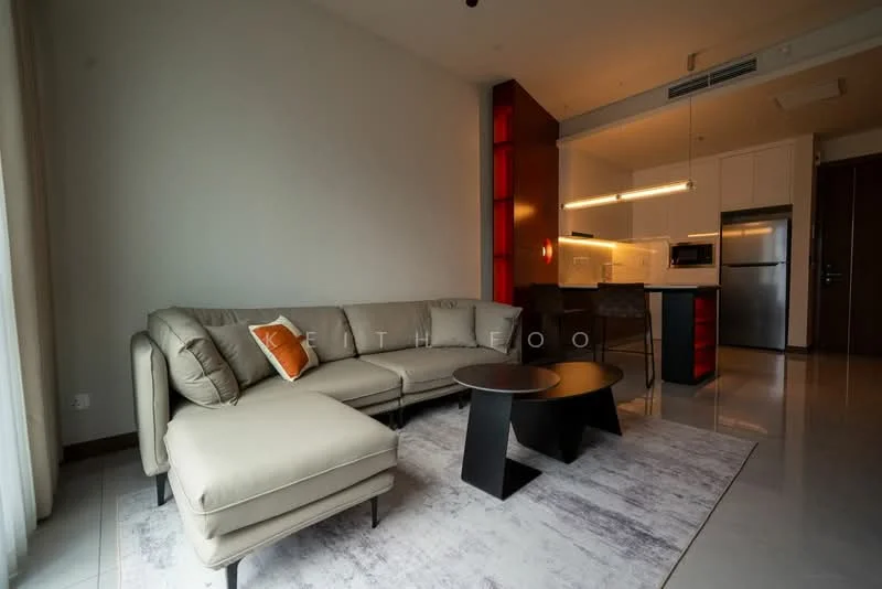 Living features: L-shape sectional sofa in beige, orange accent pillow, round black coffee table, area rug with light pattern, floor-to-ceiling windows, white painted walls, recessed downlights, open kitchen layout, bar counter with stools, stainless-steel appliances, kitchen cabinetry in white, grey countertop; style: modern.