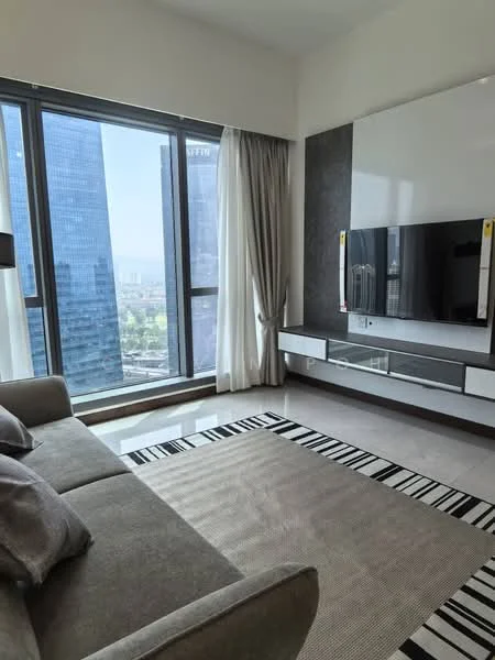 Living features: 3-seater fabric sofa in grey, TV console with wall-mounted TV, large floor-to-ceiling windows, sheer curtains, decorative area rug with geometric pattern, light-colored walls, recessed downlights, wooden flooring, built-in shelving unit, view of city skyline; style: modern; view: city.