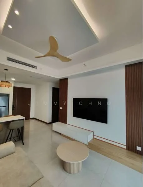 Living features: 5-blade ceiling fan with light, recessed downlights, wall-mounted TV, TV console in white, light-colored wall with wood paneling, cream-colored sofa, round coffee table, tile flooring, crown moulding, open layout to kitchen, neutral color palette; style: modern.