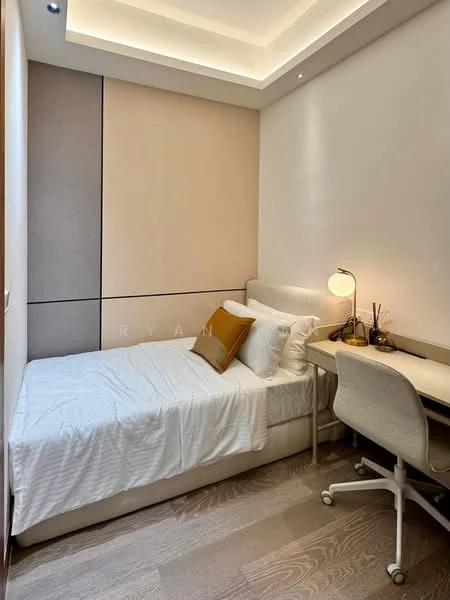 Bedroom features: single bed with white bedding, upholstered headboard, study desk with chair, table lamp, wooden flooring, recessed ceiling lights, cream painted walls, built-in wardrobe, decorative wall paneling; style: modern.