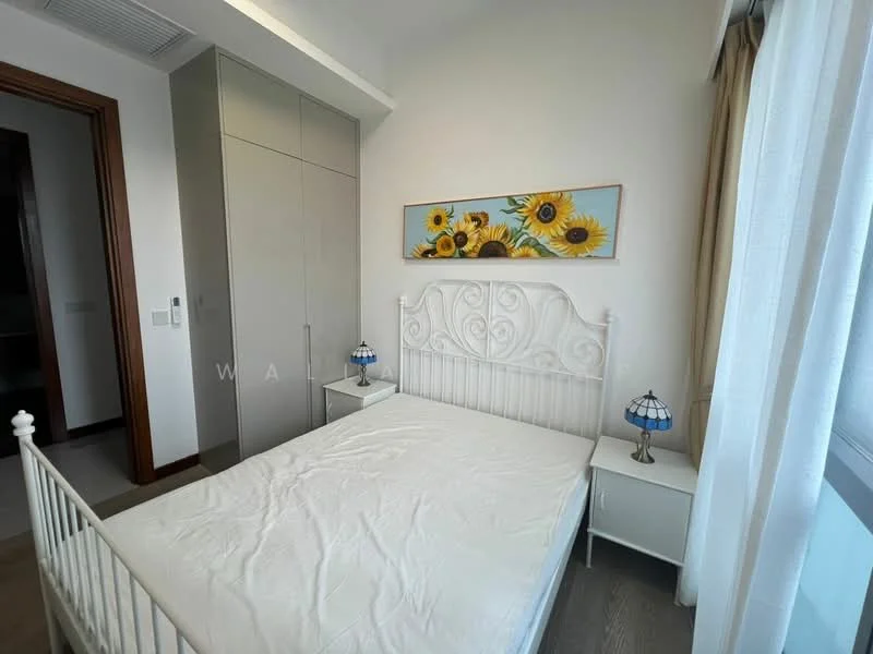 Bedroom features: white metal bed frame, mattress without bedding, two bedside tables, table lamps with stained glass shades, built-in wardrobe with sliding doors, floral artwork on wall, large window with sheer curtains, light wood flooring; style: modern.