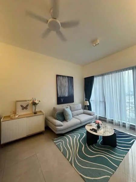 Living features: 3-seater fabric sofa in light grey, coffee table with black base and round top, area rug with wave pattern in blue and white, floor-to-ceiling windows with sheer curtains, ceiling fan, decorative wall art, sideboard with decorative items, wall-mounted artwork, neutral painted walls, tile flooring; style: modern; view: city.