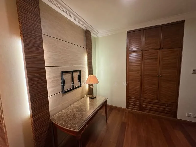 Room features: wooden flooring, cream painted walls, feature wall with textured panels, built-in wardrobe with wooden doors, table lamp on console table, console table with marble top, recessed lighting, crown moulding; style: modern.