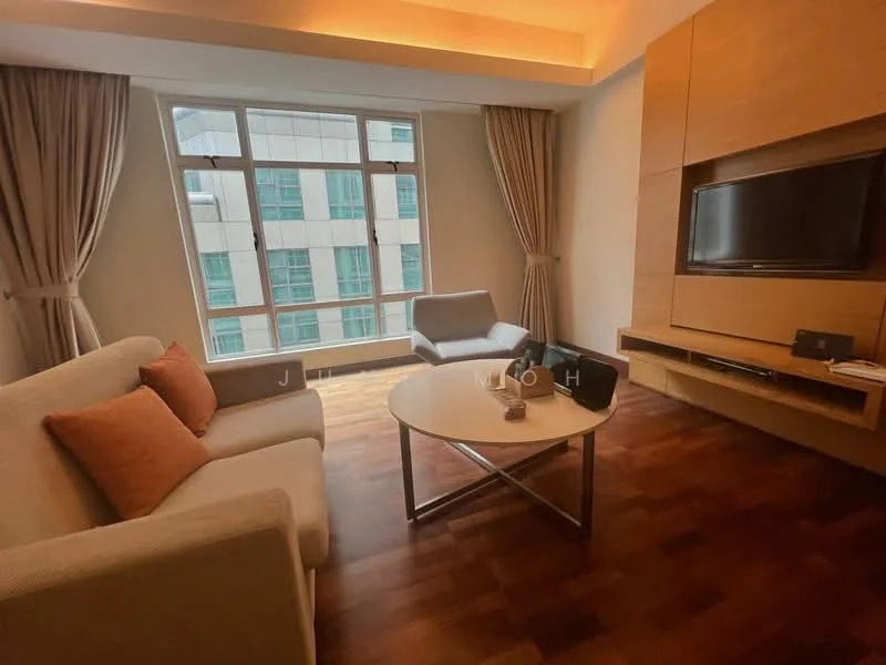 Living features: 3-seater fabric sofa in cream, 2 accent pillows in orange, coffee table with wooden top and metal base, wall-mounted TV, built-in wooden TV console, large floor-to-ceiling windows, curtains in light beige, wooden flooring, recessed ceiling lights; style: modern; view: city.