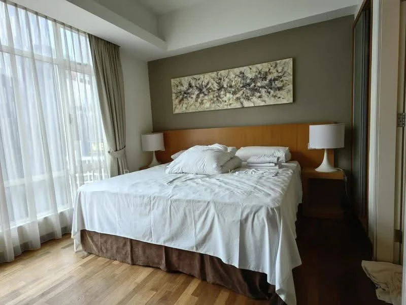 Bedroom features: king-size bed, upholstered headboard, white bedding, two bedside lamps, wooden bedside tables, large windows with sheer curtains, wooden flooring, decorative artwork above the bed, built-in wardrobe; style: modern.
