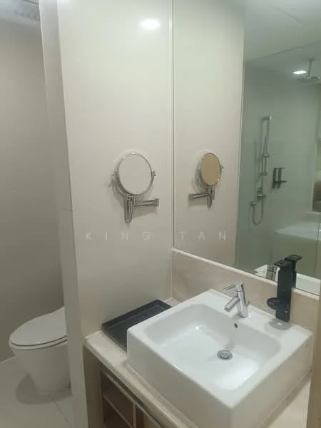 Bathroom features: white square ceramic sink, chrome basin mixer faucet, wall-mounted mirror, toilet, light-colored wall tiles, light-colored floor tiles, shower area with glass enclosure, shower head, built-in cabinetry below sink; style: modern.