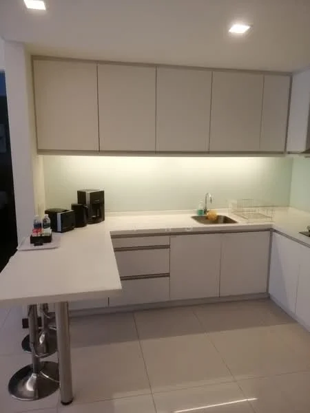 Kitchen features: white cabinetry, light green backsplash, stainless-steel sink, chrome pull-down faucet, countertop with overhang for seating, bar stools, built-in appliances, under-cabinet lighting, ceramic tile flooring, recessed downlights; style: modern.