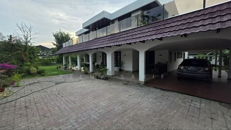 Exterior type: detached bungalow; features: paved driveway, car porch with awning, manicured lawn, flowering shrubs, two-storey structure, terracotta roof tiles, balconies with glass railings, exposed brick facade, large windows, garden area, surrounding greenery; style: modern.