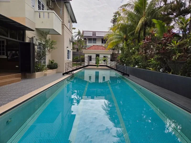 Exterior type: detached bungalow; features: infinity pool, pool deck with loungers, tropical landscaping, manicured lawn, paved walkway, surrounded by palm trees, fenced perimeter, outdoor dining area; style: modern.
