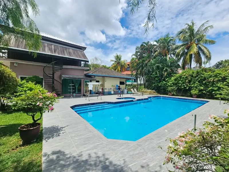 Exterior type: detached bungalow; features: infinity pool, pool deck with loungers, manicured lawn, mature palm trees, tropical landscaping, spiral staircase leading to upper level, covered patio area, surrounded by greenery; style: tropical-modern.