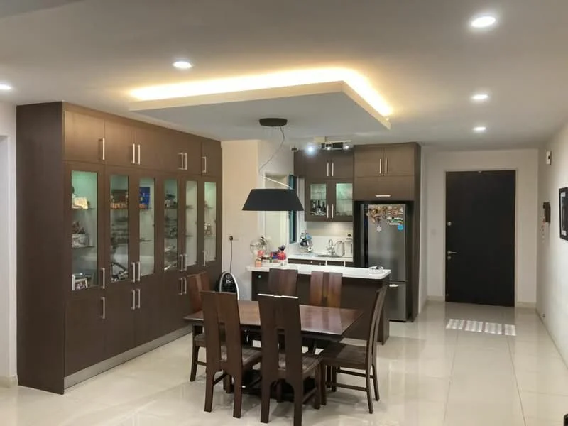 Dining features: dark wood dining table, 6 upholstered dining chairs, built-in cabinets with glass doors, stainless-steel fridge, white countertop, pendant light fixture, recessed downlights, cream tiled flooring, neutral painted walls, open layout to kitchen, kitchen island with seating; style: modern.