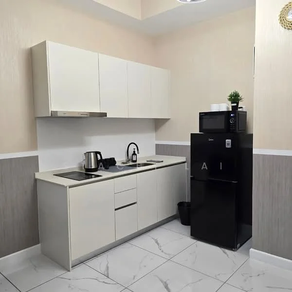 Kitchen features: white flat-panel cabinets, black refrigerator, built-in oven, stainless-steel sink, chrome pull-down faucet, black countertop, white tiled backsplash, marble tile flooring, kettle, microwave, black trash bin, decorative plant on countertop; style: modern.