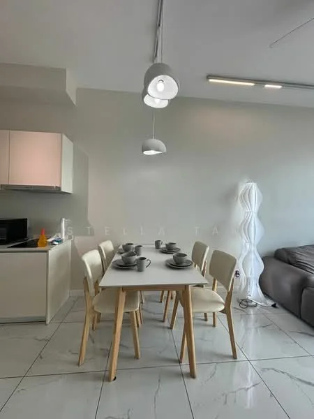 Dining features: white dining table, 4 wooden dining chairs, ceramic dinnerware, pendant lighting, grey sofa in background, white painted walls, marble tile flooring, kitchenette with white cabinets, black countertop, recessed ceiling lights; style: modern.