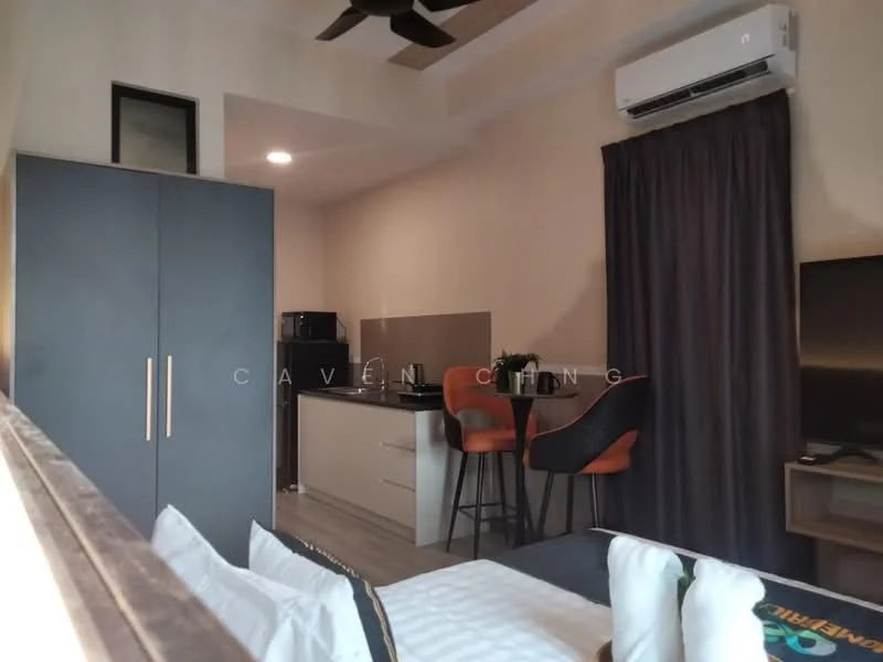 Room features: grey cabinetry, black countertop, stainless-steel fridge, built-in microwave, 2 high stools, kitchenette area, wall-mounted TV, ceiling fan, curtains, light-colored walls, wooden flooring, recessed lighting; style: modern.