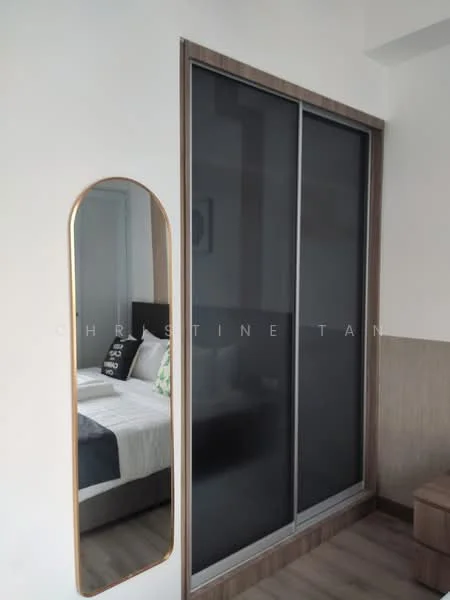 Bedroom features: queen-size bed with black headboard, bedding in white and grey, decorative pillows in green and black, built-in wardrobe with sliding doors, full-length mirror with wooden frame, wooden flooring, white painted walls, nightstand with lamp; style: modern.
