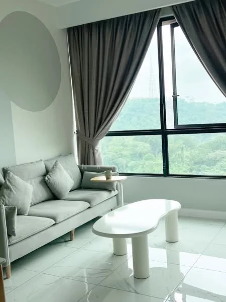 Living features: grey fabric sofa with cushions, white coffee table with curved edges, floor-to-ceiling windows, sheer curtains, tile flooring, neutral wall color, decorative wall circle, greenery view outside; style: modern; view: garden.