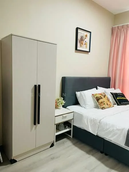 Bedroom features: queen-size bed with grey upholstered headboard, white bedding, two decorative pillows, nightstand with drawer, white lamp on nightstand, light-colored wardrobe with two doors, framed artwork on wall, pink curtains, light wood flooring, decorative flower arrangement; style: modern.